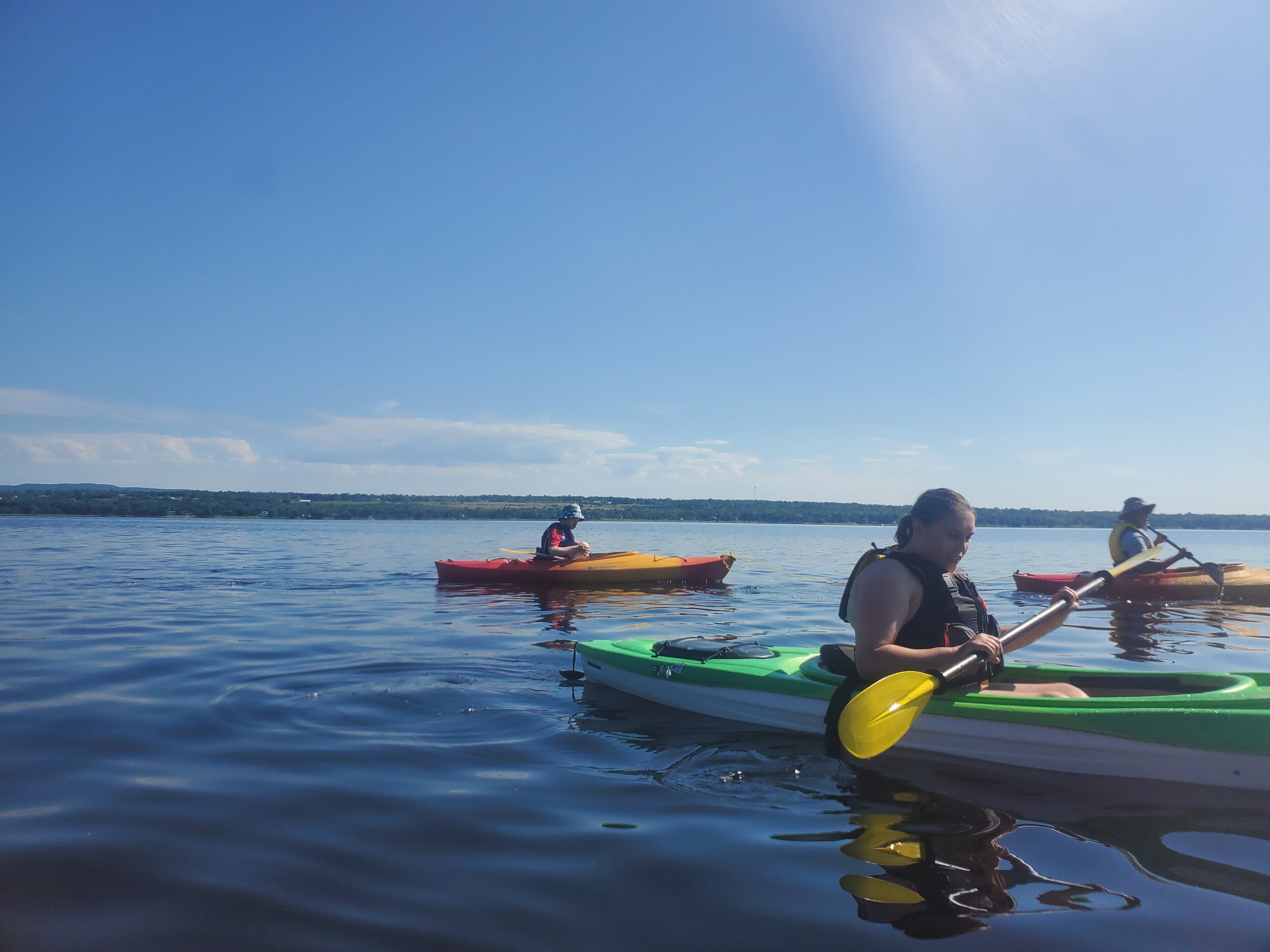 PA campers paddling on the river in rec kayaks