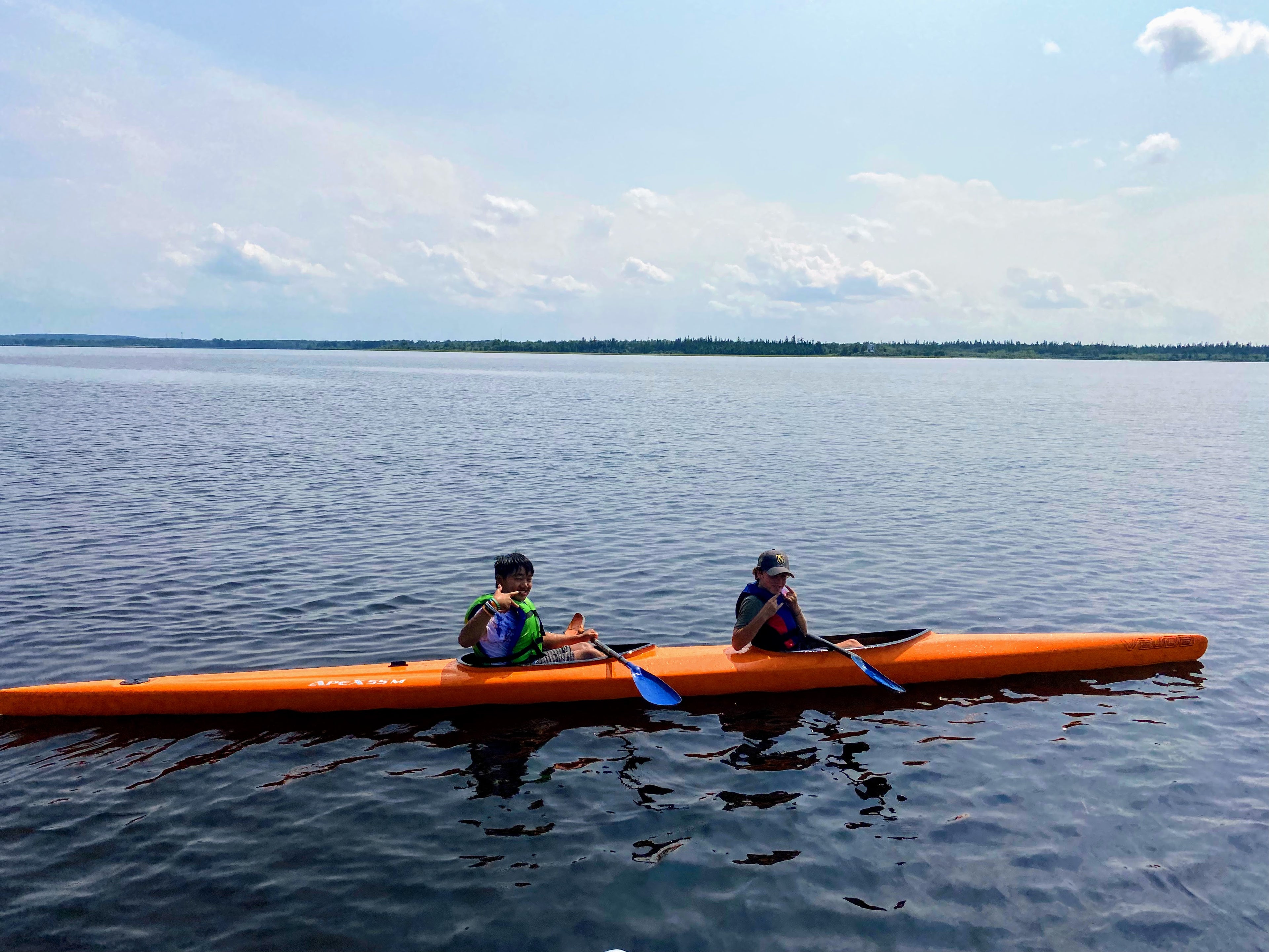 Youth campers use an orange K2 for a day trip to Aylmer Island.