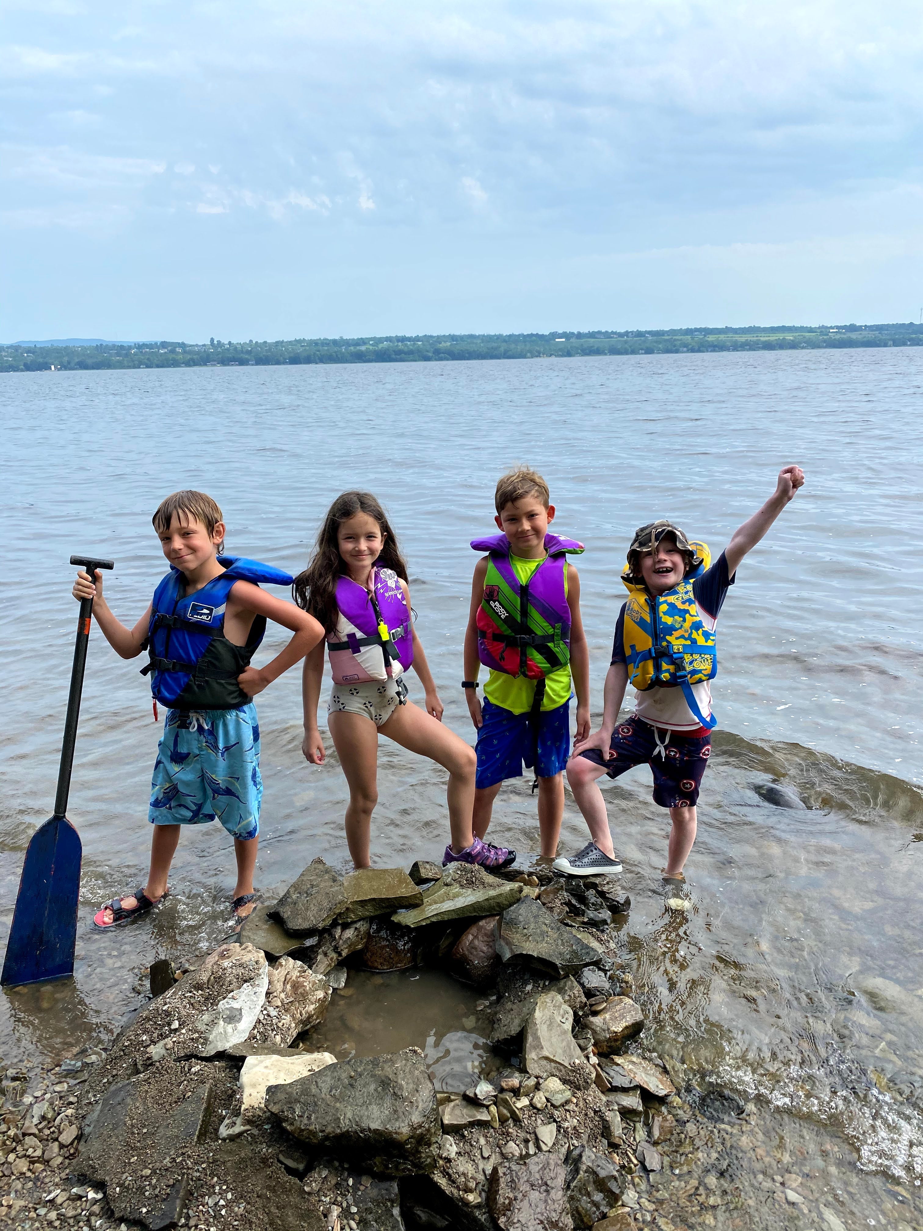 Canoe Kids campers building a fort on the Ottawa River.